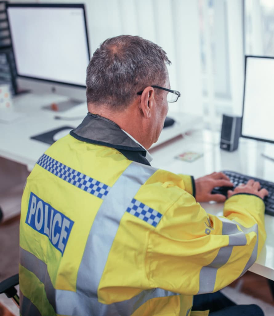 A police officer is working at his desk