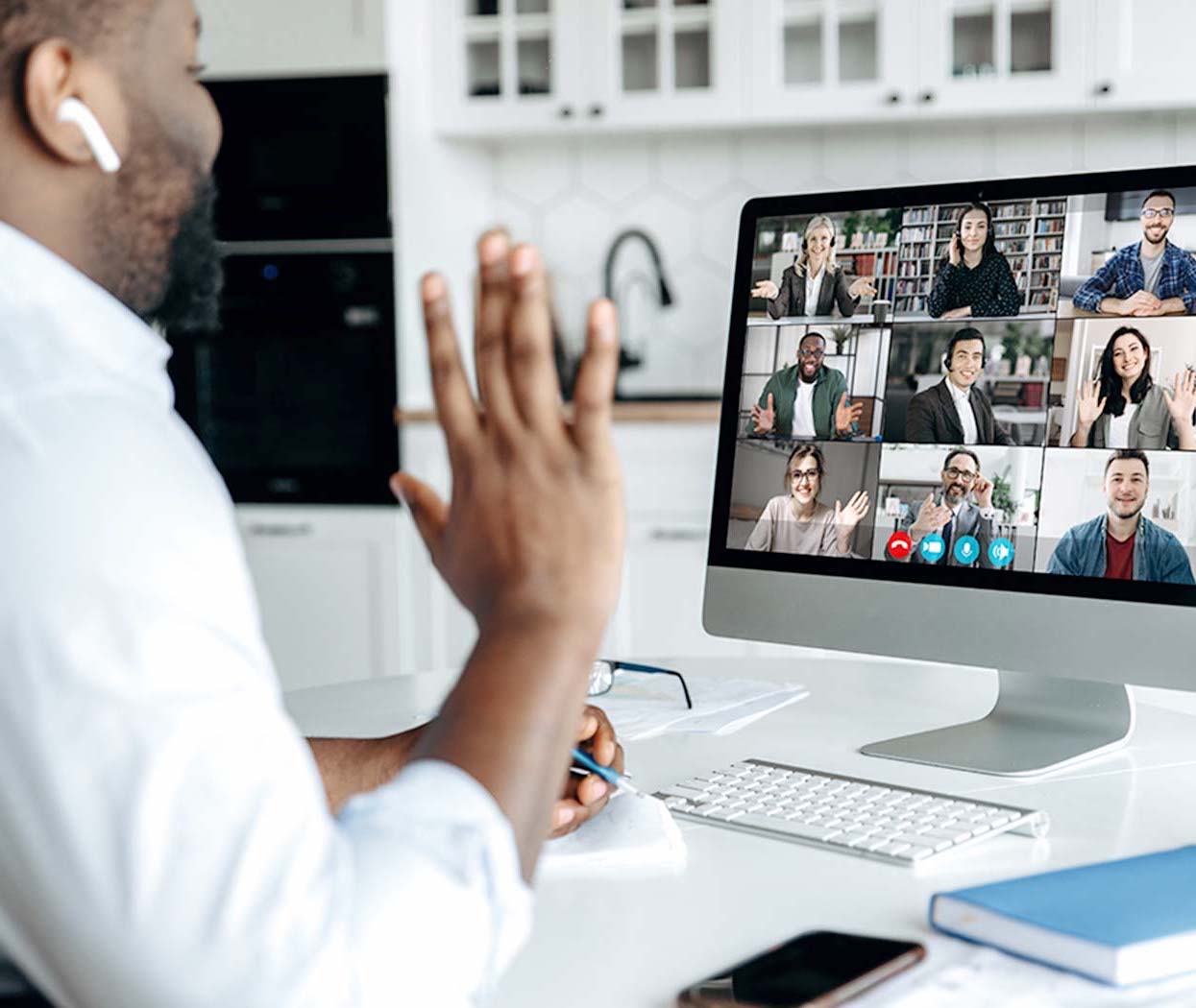 A Black male doing a video meeting.