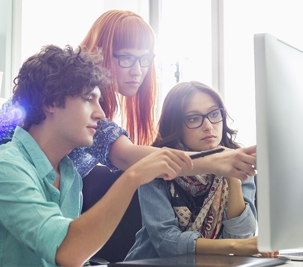 Three people in front of a screen