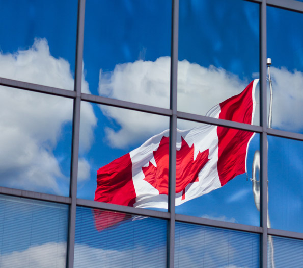 Canadian flag flying in window