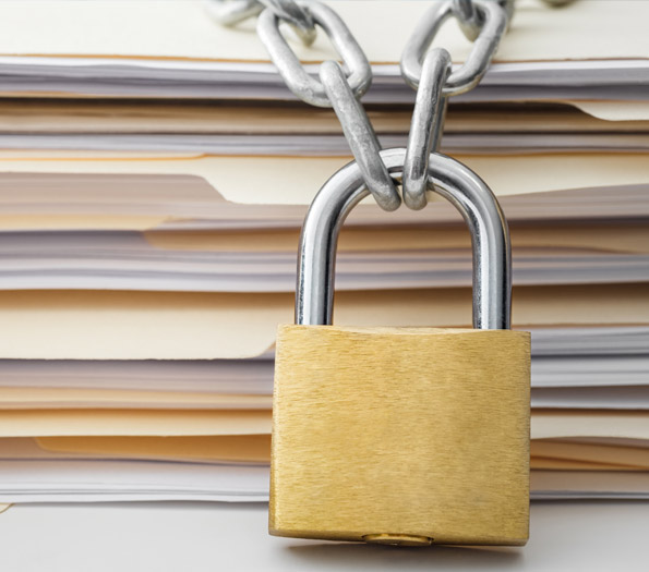 Privacy Rights in Canada | Sterling Talent Solutions Lock on a stack of files