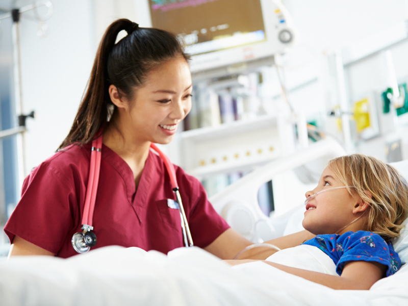 A female nurse taking care of a children